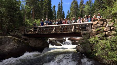 2014 Camp Colorado participants enjoy the view over North Saint Vrain Creek in Wild Basin, Rocky Mountain National Park.